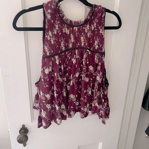 Alice and Olivia 100% silk cold shoulder crop top with zip up back.